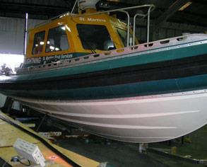 Pilot vessel requiring a rubber fender replacement